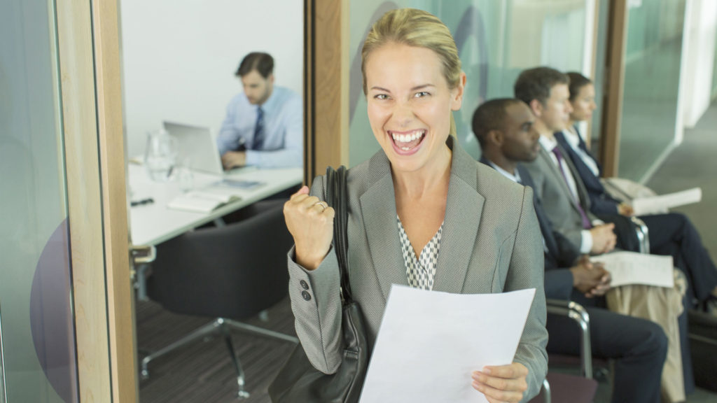 happy-woman-leaving-an-interview